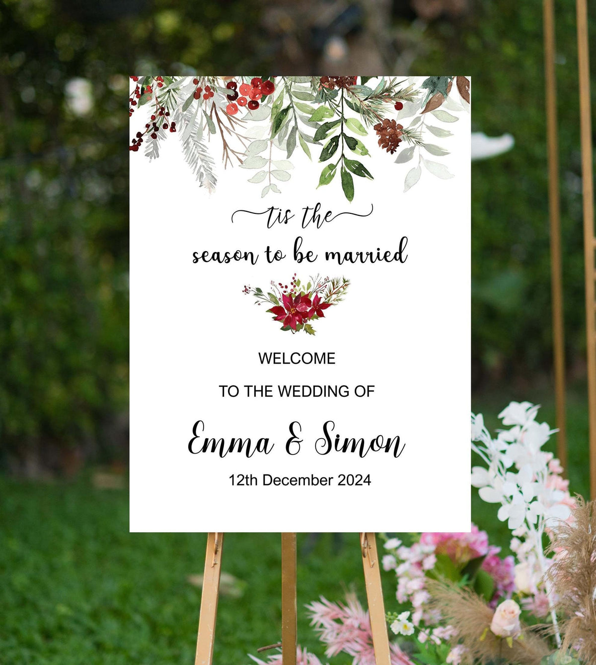 Matching Christmas greenery wedding welcome sign with red berries and personalized names