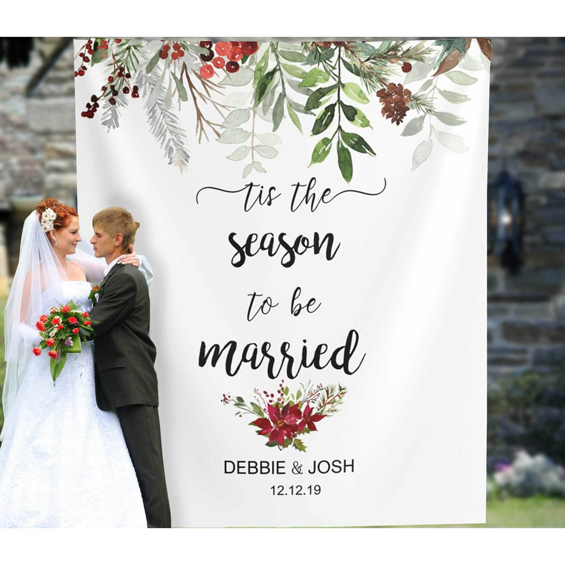 Christmas wedding fabric backdrop with greenery red berries and Tis the Season to Be Married lettering